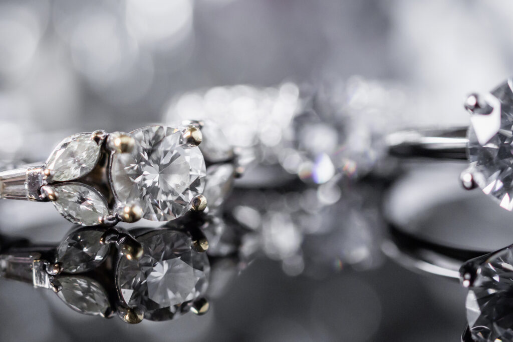 Luxury Jewelry diamond rings with reflection on black background