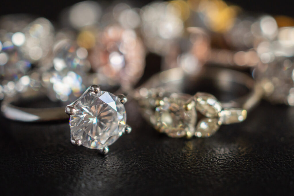 Jewelry diamond rings set on black background close up